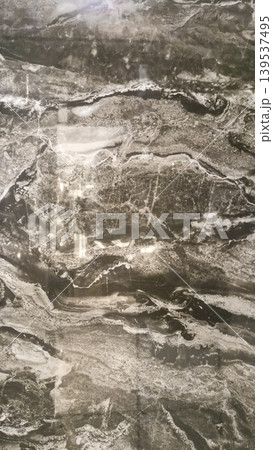 Black Italian marble texture with gold and white vein patterns. Black Italian marble texture with gold and white vein patterns. 139537495