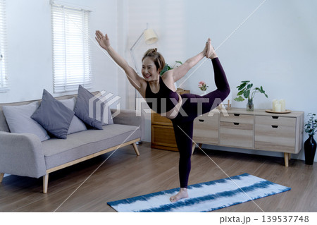 oman is doing yoga stand poses in her living room as a way to pass 50+ oman is doing yoga stand poses in her living room as a way to pass 50+ 139537748