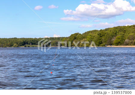 Lyngby Lake landscape with blue sky and rowing lanes in Denmark. Lyngby Lake landscape with blue sky and rowing lanes in Denmark. 139537800