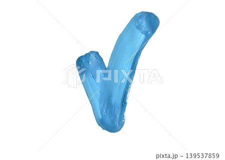 A stroke of blue acrylic paint in the shape of a check mark. A stroke of blue acrylic paint in the shape of a check mark. 139537859