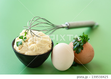 fresh mayonnaise dip served on pastel green background fresh mayonnaise dip served on pastel green background 139538425