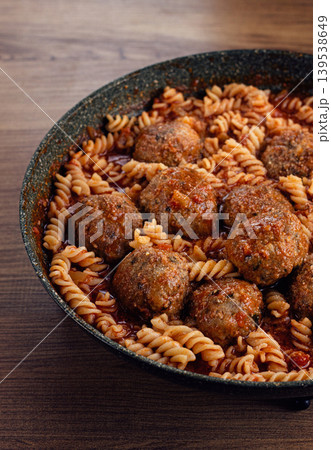 minced meat meatballs, in tomato sauce, with fusilli pasta, in a cast-iron pan, homemade, no people, 139538649