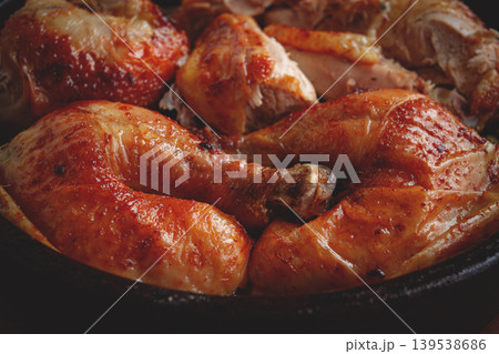 Grilled chicken pieces in a frying pan, wooden background, top view, homemade, no people, Grilled chicken pieces in a frying pan, wooden background, top view, homemade, no people, 139538686