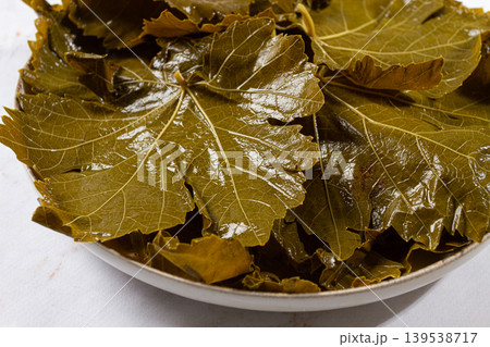 canned grape leaves, for cooking dolma, on a plate, 139538717