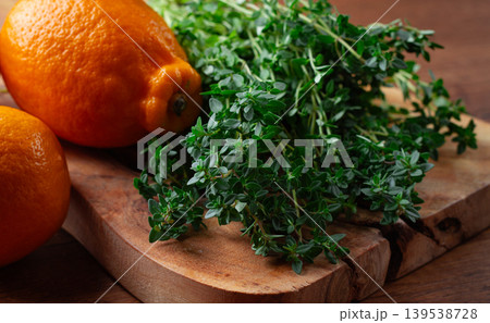 lemon thyme, on a wooden chopping board, with lemons, close-up, lemon thyme, on a wooden chopping board, with lemons, close-up, 139538728