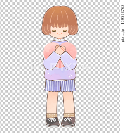 A little girl smiling while holding a heart. 139538762