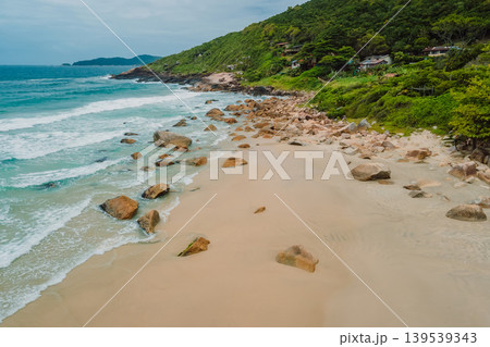 Beach, mountains and blue ocean with waves in Brasil. Drone view 139539343