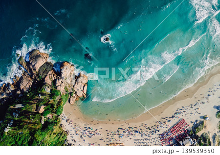 Joaquina beach in Florianopolis with rocks and ocean with waves. Aerial photo Joaquina beach in Florianopolis with rocks and ocean with waves. Aerial photo 139539350