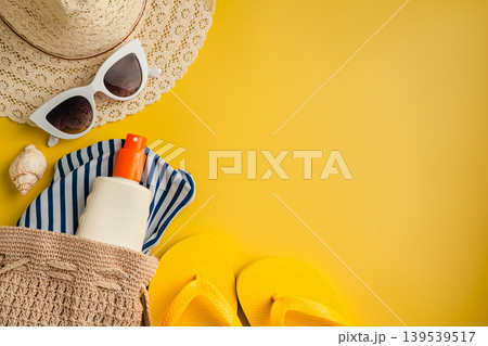 Summer holiday flat lay yellow background. Beach travel accessories for vacation. Sunglasses, sun hat, sunscreen. Copy space Summer holiday flat lay yellow background. Beach travel accessories for vacation. Sunglasses, sun hat, sunscreen. Copy space 139539517