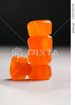 Jelly gummy fruit vitamins, food supplements.Orange vitamins stack Jelly gummy fruit vitamins, food supplements.Orange vitamins stack 139539544