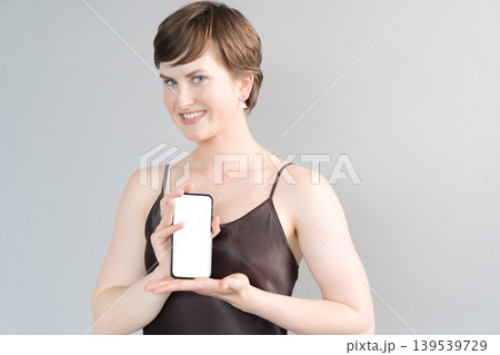 Happy young girl isolated over gray background Happy young girl isolated over gray background 139539729