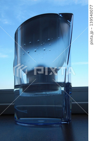 Clear Water Filter Pitcher On Windowsill Clear Water Filter Pitcher On Windowsill 139540077