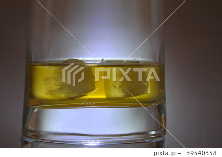 Whiskey with Ice in a Glass with Massive Bottom Detailed Stock Photo  139540358