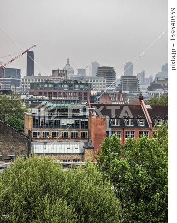 Elevated Urban Cityscape with Railway Tracks Dense Residential Buildings and Modern Metropolitan Elevated Urban Cityscape with Railway Tracks Dense Residential Buildings and Modern Metropolitan 139540559