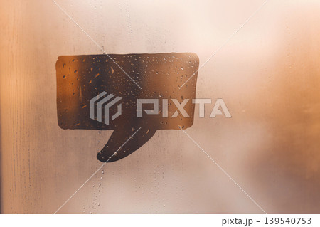 Hand drawn one speech bubble shape cloud signboard for text on muddy cold glass wet window at home, copy space Hand drawn one speech bubble shape cloud signboard for text on muddy cold glass wet window at home, copy space 139540753