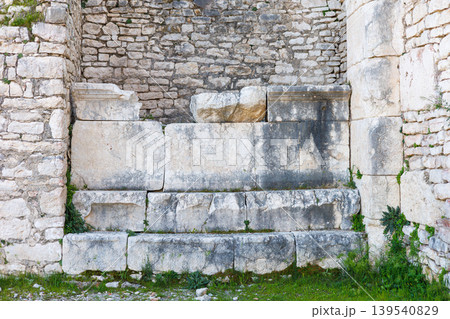 Ancient stone wall structure with weathered blocks in archaeological Ancient stone wall structure with weathered blocks in archaeological 139540829