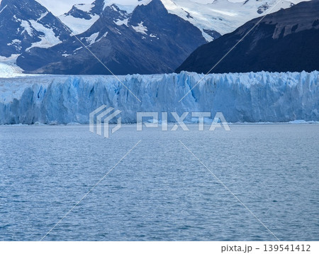 The snow-capped Andes and the blue surface of the Perito Moreno Glacier in Santa Cruz Province, Argentina. Patagonia. The snow-capped Andes and the blue surface of the Perito Moreno Glacier in Santa Cruz Province, Argentina. Patagonia. 139541412