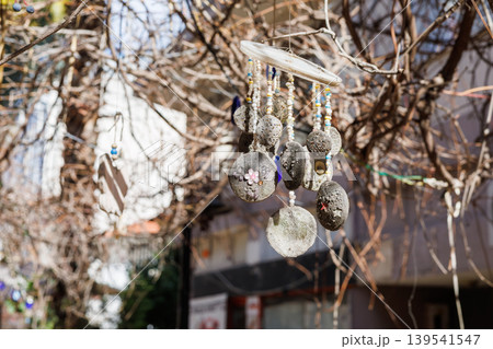Hanging stone craft decoration on tree branches Hanging stone craft decoration on tree branches 139541547
