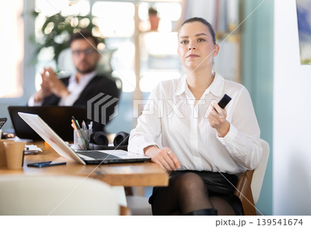 Employees of a company in the field of modern technology are sitting in the office Employees of a company in the field of modern technology are sitting in the office 139541674