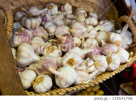 Garlic closeup in basket on market counter Garlic closeup in basket on market counter 139541706