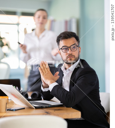 Female manager starts presentation demonstration using remote control 139541707