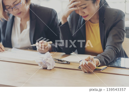 Asian businesswoman overworked at office stressful anxiety with serious problems. Woman exhaustion depress and mental burnout feeling tired frustrate at company office. Stress sadness contemplation Asian businesswoman overworked at office stressful anxiety with serious problems. Woman exhaustion depress and mental burnout feeling tired frustrate at company office. Stress sadness contemplation 139543357