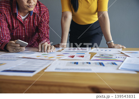 Top view business people meeting together at office desk in conference room. Team business meeting partnership planning brainstorming together. Team Collaborate group of partner company brainstorming 139543831
