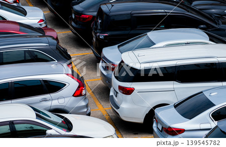 Car parked at parking lot of the airport for rental. Aerial view of car parking lot of the airport. Used luxury car for sale and rental service. Automobile parking space. Car dealership concept. Car parked at parking lot of the airport for rental. Aerial view of car parking lot of the airport. Used luxury car for sale and rental service. Automobile parking space. Car dealership concept. 139545782
