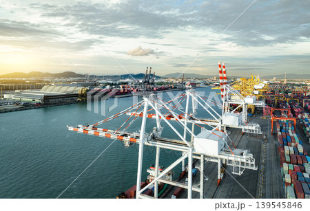Logistics and transportation of container cargo ship at ship port. Container truck and crane bridge in shipyard. Import export and transport industry. Terminal port for export transport by ship. Logistics and transportation of container cargo ship at ship port. Container truck and crane bridge in shipyard. Import export and transport industry. Terminal port for export transport by ship. 139545846