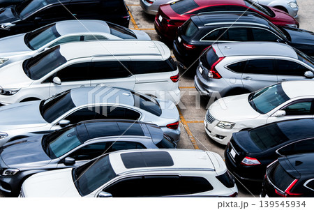 Car parked at parking lot of the airport for rental. Aerial view of car parking lot of the airport. Used luxury car for sale and rental service. Automobile parking space. Car dealership concept. 139545934