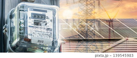 Watt hour meter on rooftop solar, wind turbine, and electric pylon background. Sustainable energy. Solar and wind power. Renewable energy. Energy crisis. Carbon neutrality. Sustainable resources. Watt hour meter on rooftop solar, wind turbine, and electric pylon background. Sustainable energy. Solar and wind power. Renewable energy. Energy crisis. Carbon neutrality. Sustainable resources. 139545983