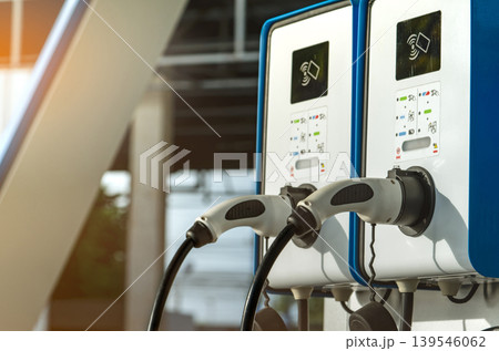 Electric car charging station for charge EV battery. Plug for vehicle with electric and hybrid engine. EV charger. Clean energy. Charging point for EV car. Green power. Future transport technology. Electric car charging station for charge EV battery. Plug for vehicle with electric and hybrid engine. EV charger. Clean energy. Charging point for EV car. Green power. Future transport technology. 139546062