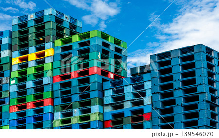 Pile of plastic shipping pallet. Industrial plastic pallet stacked at factory warehouse. Cargo and shipping concept. Plastic pallet rack for export delivery industry. Plastic pallet storage warehouse. Pile of plastic shipping pallet. Industrial plastic pallet stacked at factory warehouse. Cargo and shipping concept. Plastic pallet rack for export delivery industry. Plastic pallet storage warehouse. 139546070