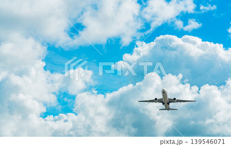 Under view of commercial passenger airplane flying in blue sky, aviation travel concept showing flight after takeoff or before landing, global air transportation for vacation and international journey Under view of commercial passenger airplane flying in blue sky, aviation travel concept showing flight after takeoff or before landing, global air transportation for vacation and international journey 139546071