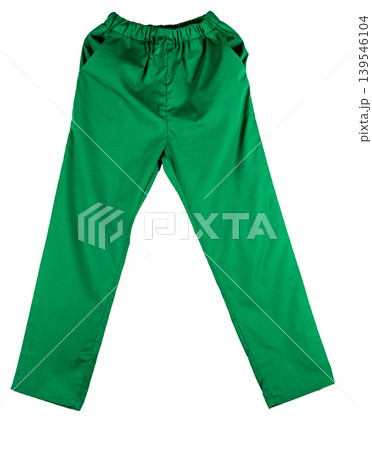 Green medical scrubs uniform pants isolated on white background. Workwear for doctors nurses dentists and veterinarians, healthcare clothing concept showing practical design with pockets and comfort. Green medical scrubs uniform pants isolated on white background. Workwear for doctors nurses dentists and veterinarians, healthcare clothing concept showing practical design with pockets and comfort. 139546104
