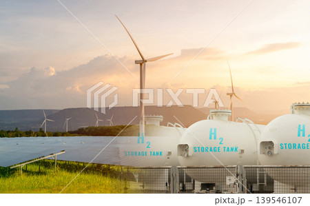 H2 fuel storage tank with green hydrogen concept. Sustainable renewable energy. Net zero emissions by 2050. Solar panel and wind turbine generate electricity for hydrogen gas production. Clean energy. 139546107