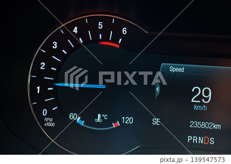 Car dashboard display with tachometer and digital speed readout Car dashboard display with tachometer and digital speed readout 139547573