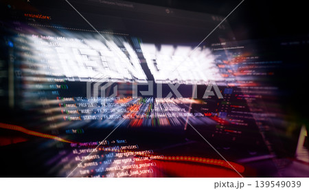 System overload and cyber attack concept. Abstract chaotic digital background with coding script and fast red light trails. 139549039