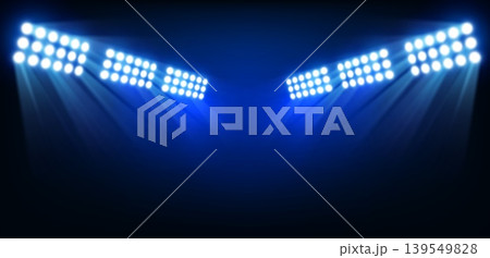 Stadium floodlights with bright white spotlights and blue beams on dark arena background, realistic sports lighting banner for night match, championship or event presentation. Vector illustration Stadium floodlights with bright white spotlights and blue beams on dark arena background, realistic sports lighting banner for night match, championship or event presentation. Vector illustration 139549828