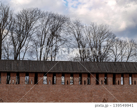 Ancient brick fortress wall and tower battlements in Smolensk Historic Russian defensive architecture Ancient brick fortress wall and tower battlements in Smolensk Historic Russian defensive architecture 139549941
