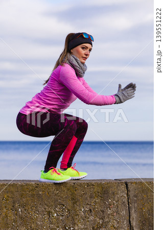 Woman fitness sport girl training outdoor in cold weather Woman fitness sport girl training outdoor in cold weather 139551222