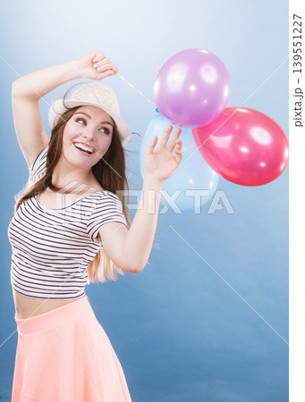 Woman summer joyful girl with colorful balloons Woman summer joyful girl with colorful balloons 139551227