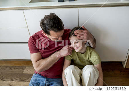Parent providing mental health support to teenage child facing challenges at home. Parent providing mental health support to teenage child facing challenges at home. 139551389