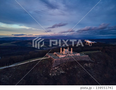 Aerial view of a stone monument, memorial on a hill during sunset. The Barrow of Milan Rastislav Stefanik in Slovakia. Aerial view of a stone monument, memorial on a hill during sunset. The Barrow of Milan Rastislav Stefanik in Slovakia. 139551741