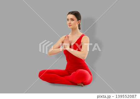 Yoga session with person in red seated Yoga session with person in red seated 139552087