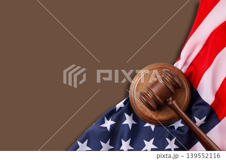 Gavel rests on American flag symbolizing justice and celebration 139552116