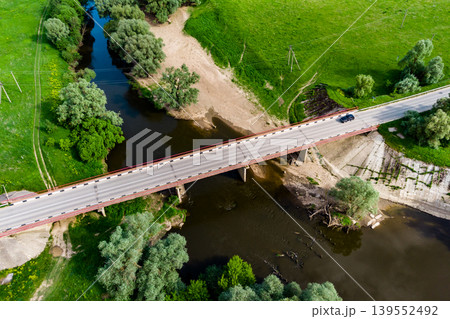 View from a drone of a road bridge over the river with cars driving along it 139552492