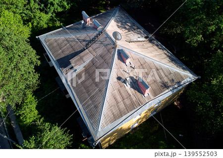 Roof of a residential apartment building covered with slate, aerial view Roof of a residential apartment building covered with slate, aerial view 139552503