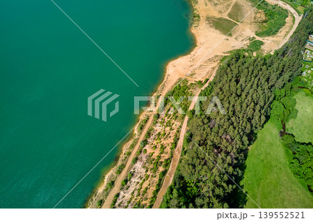 Turquoise waters of a flooded sand quarry, view from above Turquoise waters of a flooded sand quarry, view from above 139552521