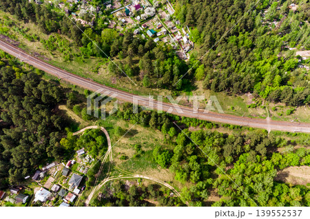 An aerial view of the railway tracks running through the countryside An aerial view of the railway tracks running through the countryside 139552537